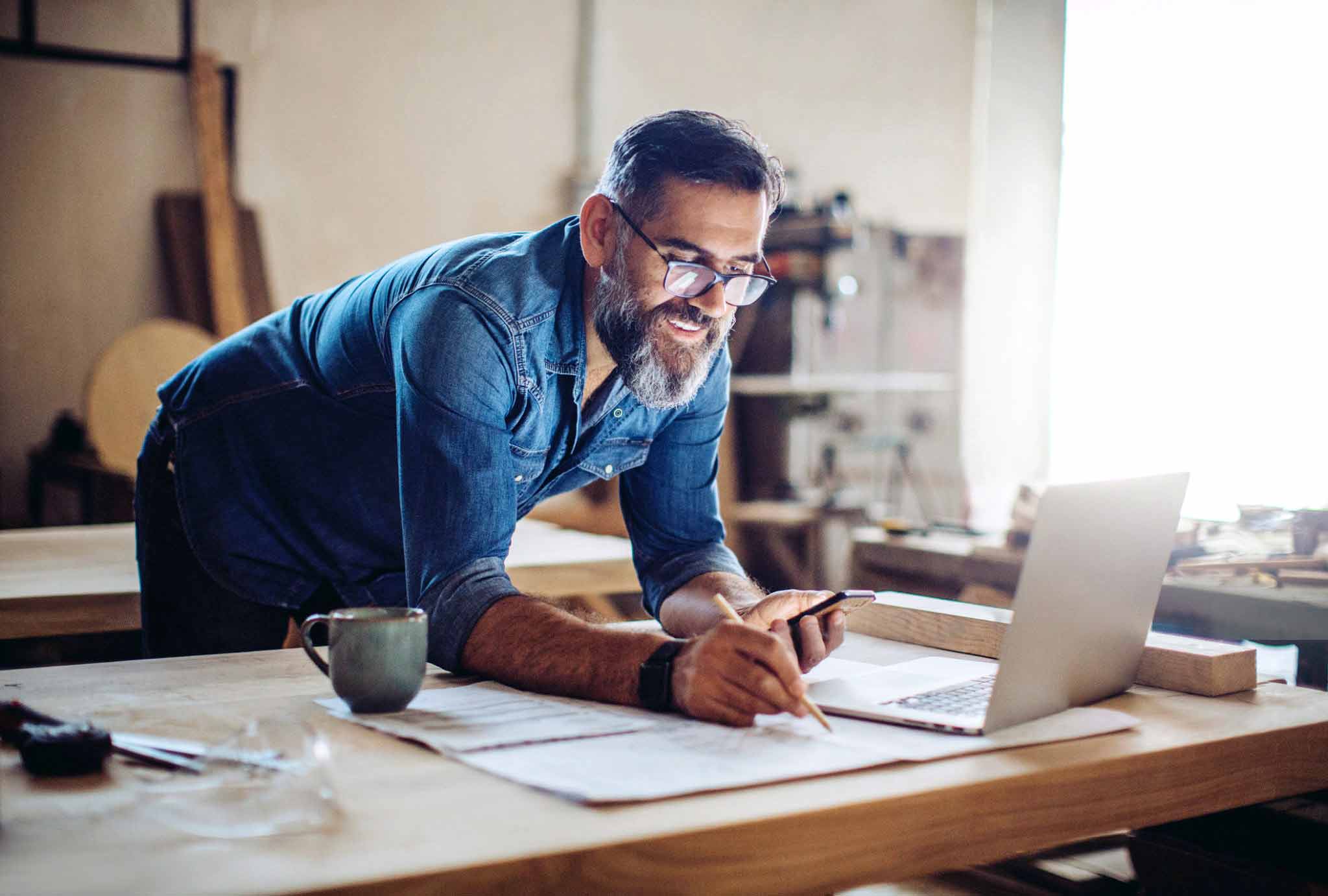 Man sketching on table