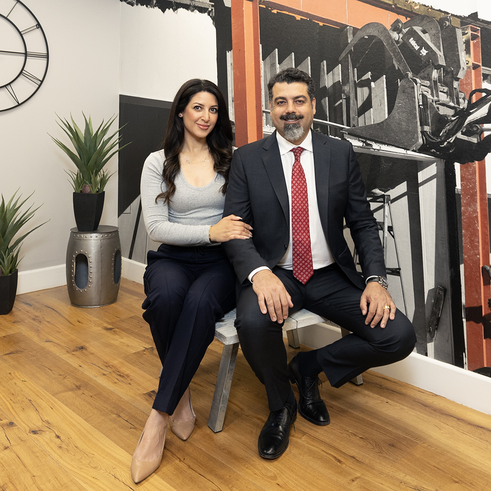 a man and woman sitting on a chair