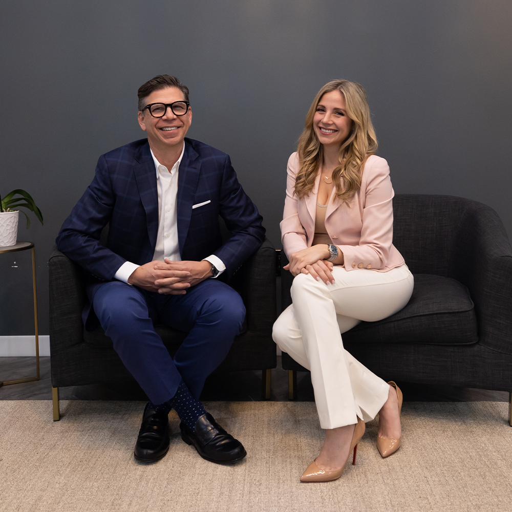 a man and woman sitting on chairs
