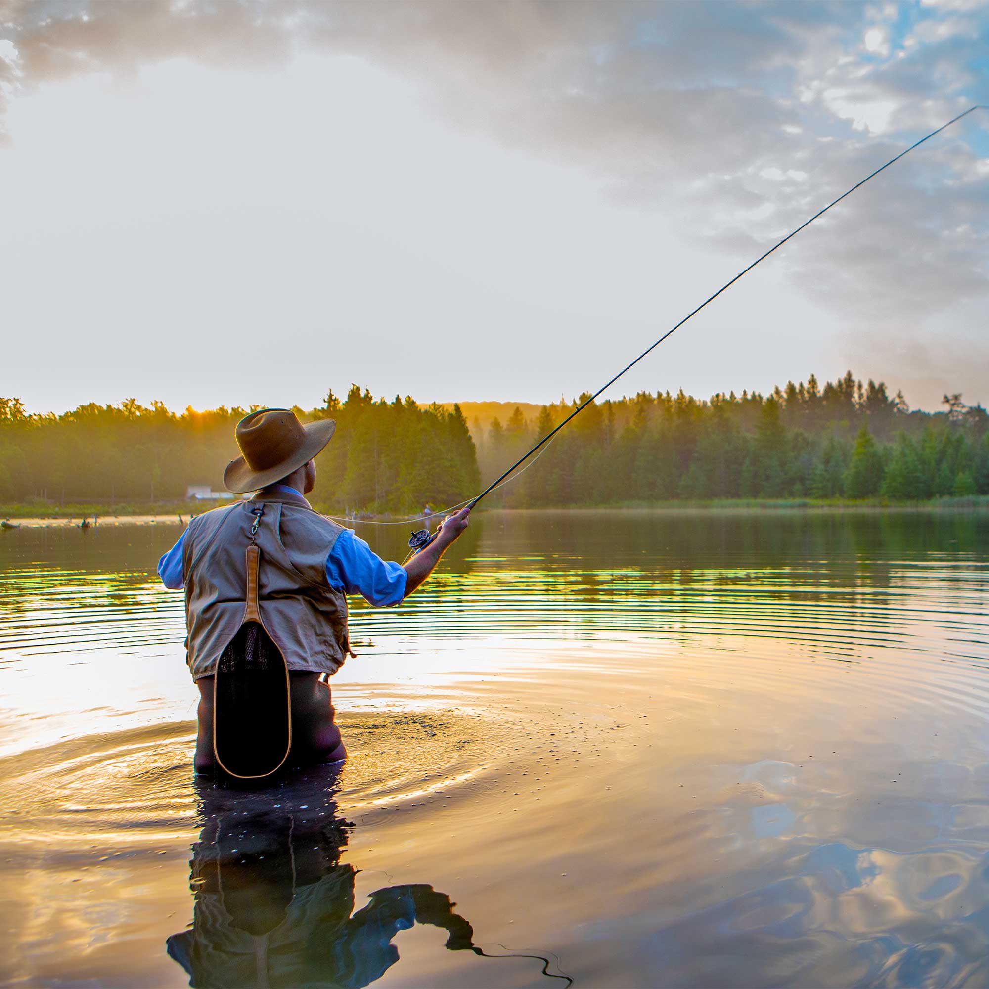 a man fishing in the water