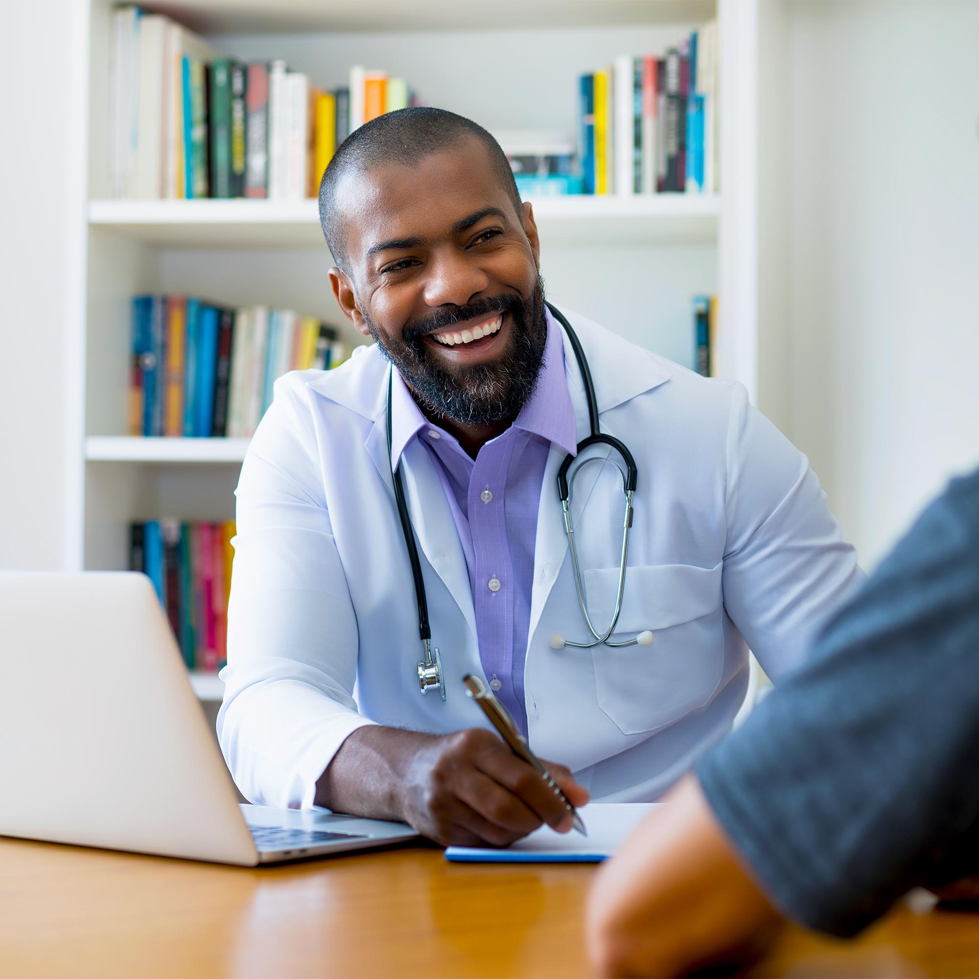 a doctor smiling at a patient