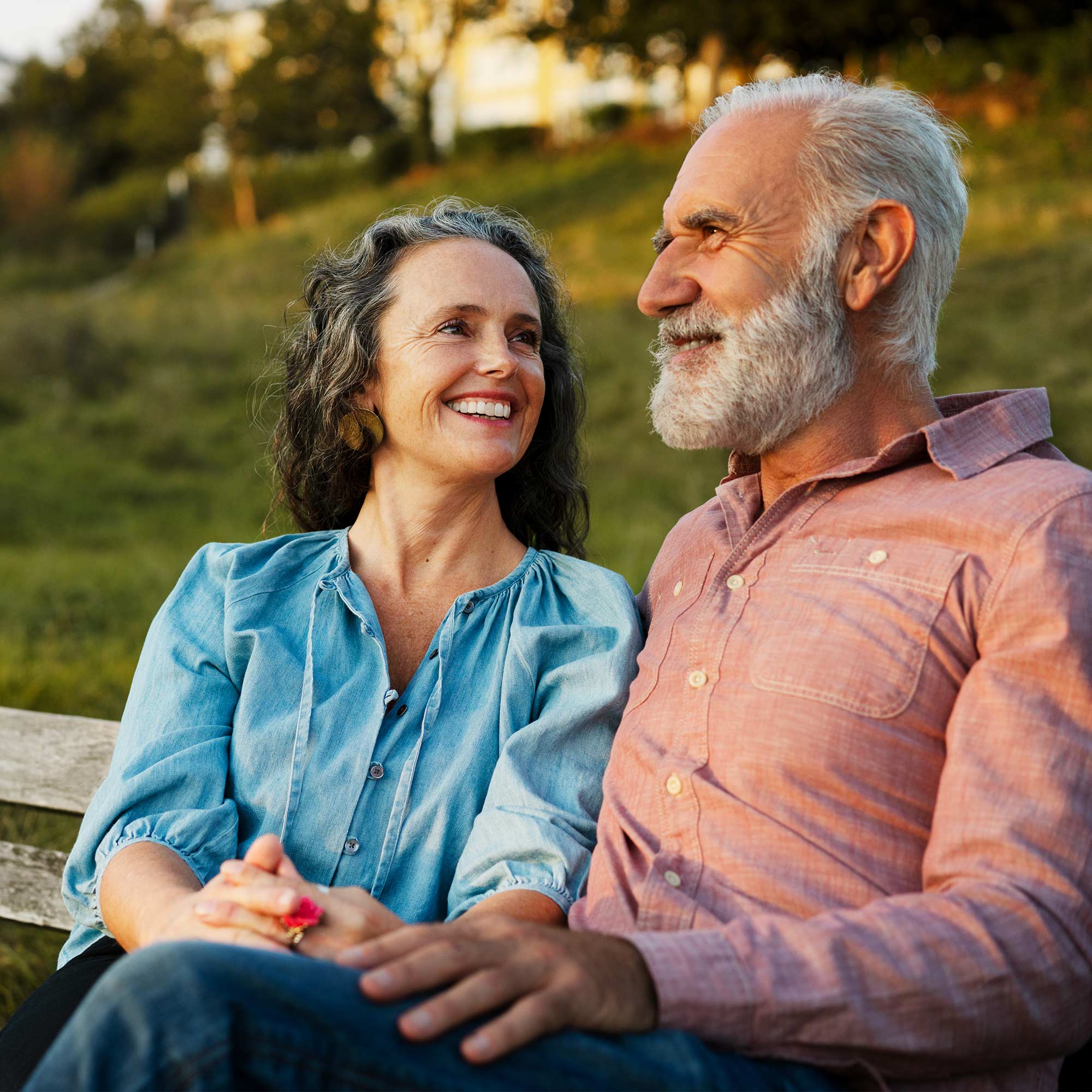 a man and woman sitting on a bench