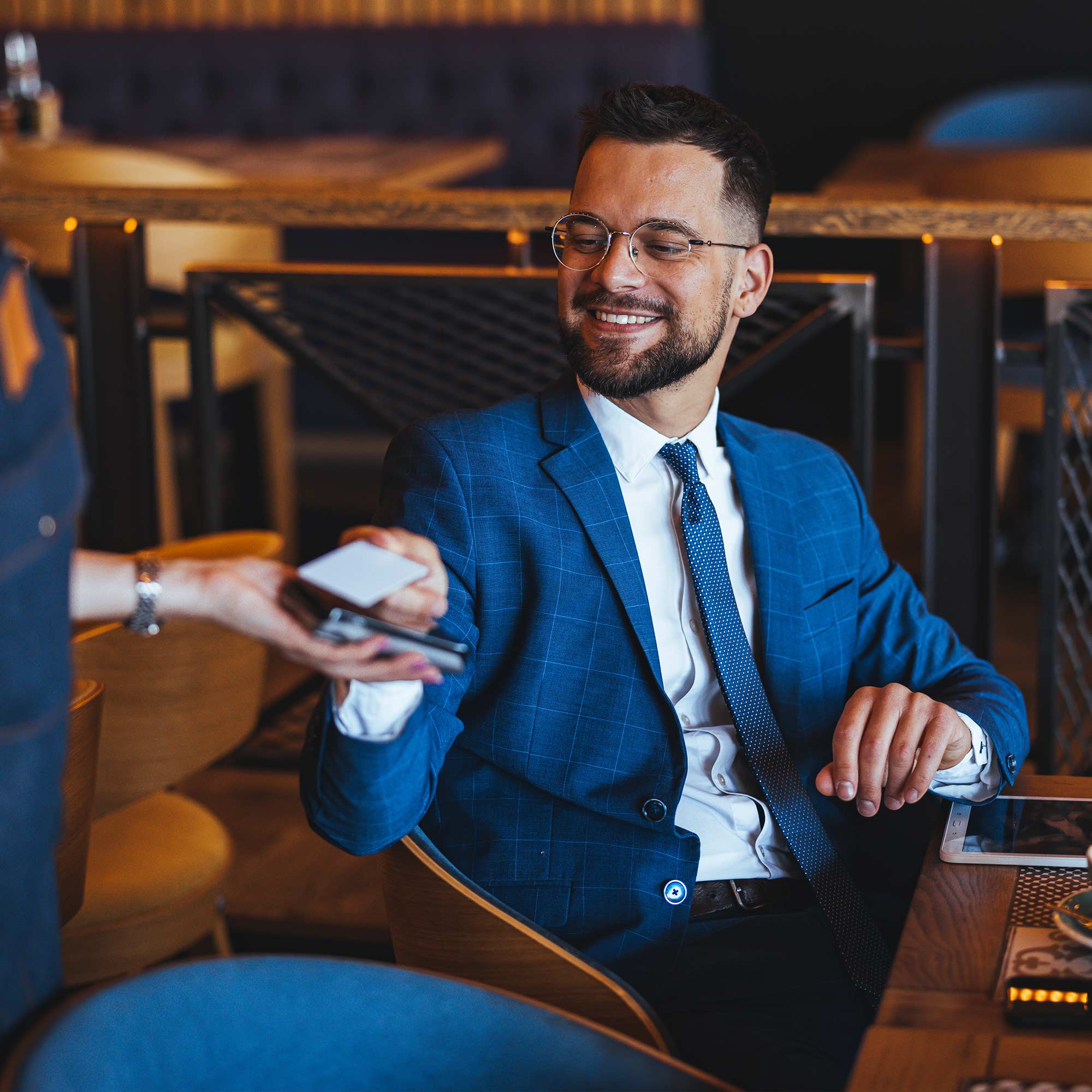 a man in a suit talking to a woman