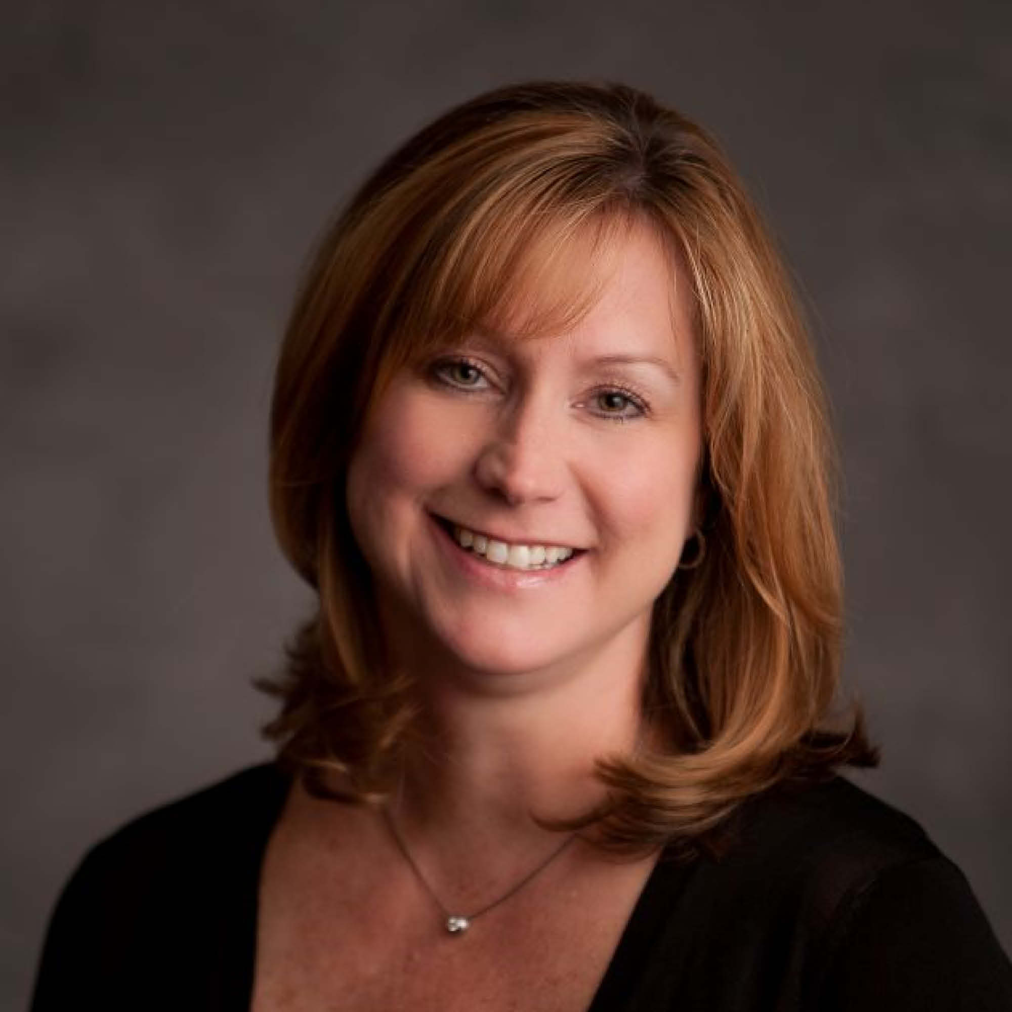 a woman smiling at the camera