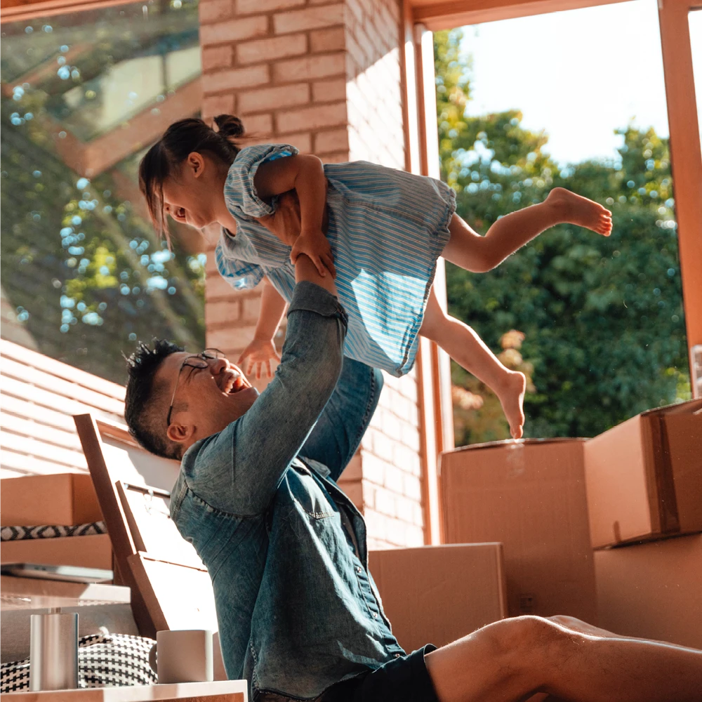 man lifting his child in the air man lifting his child in the air