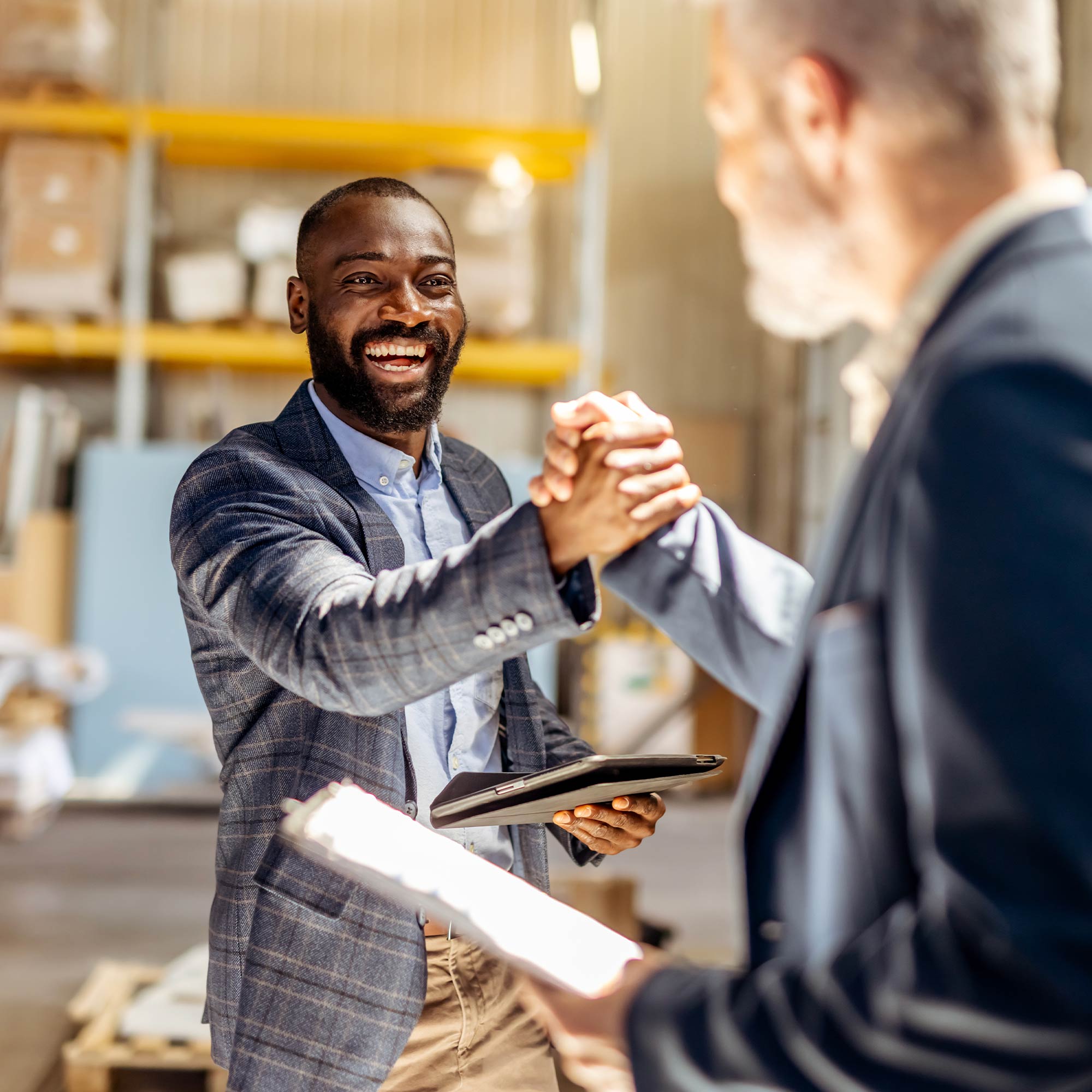 a man shaking hands with another man