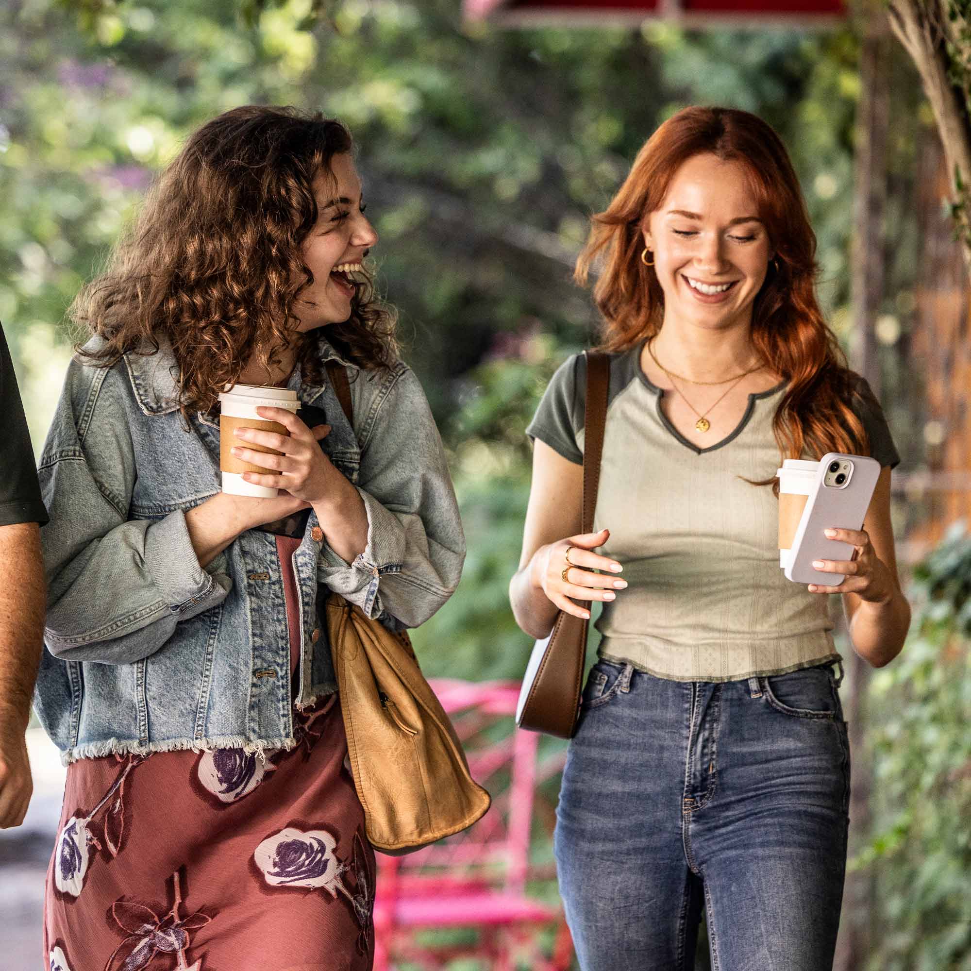 a group of women walking down a sidewalk