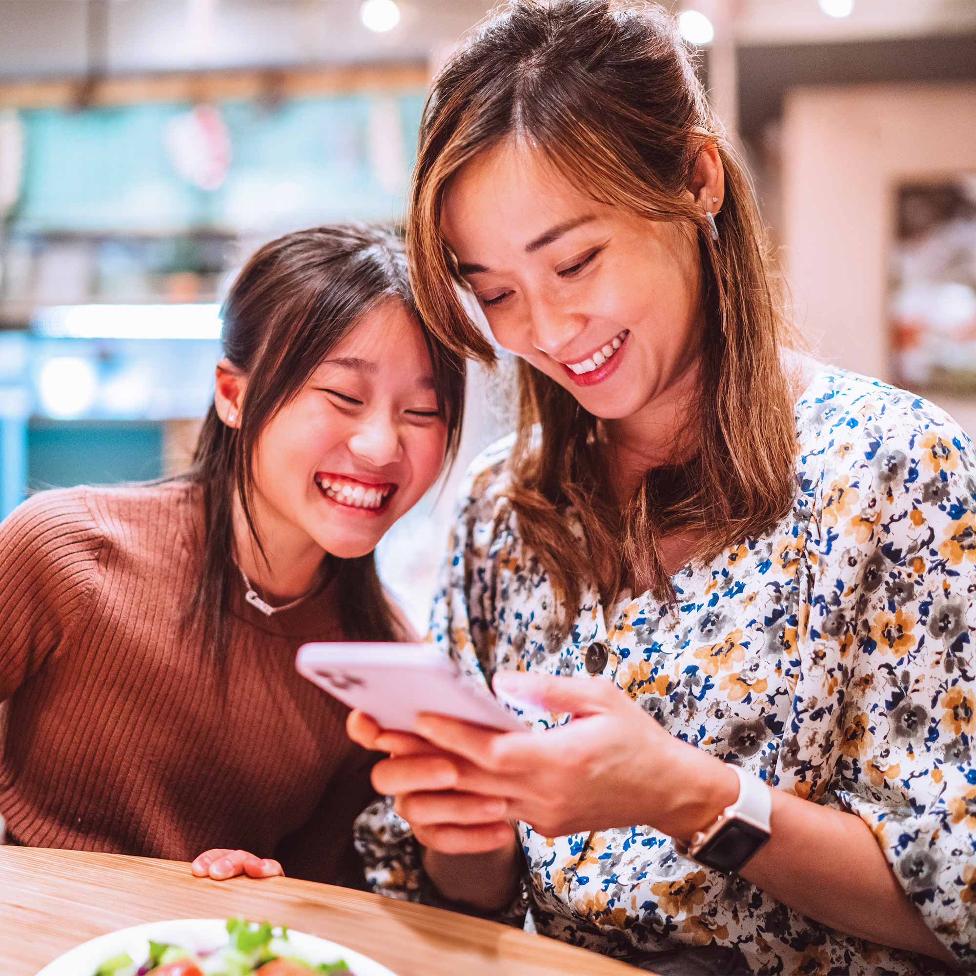a woman looking at a phone