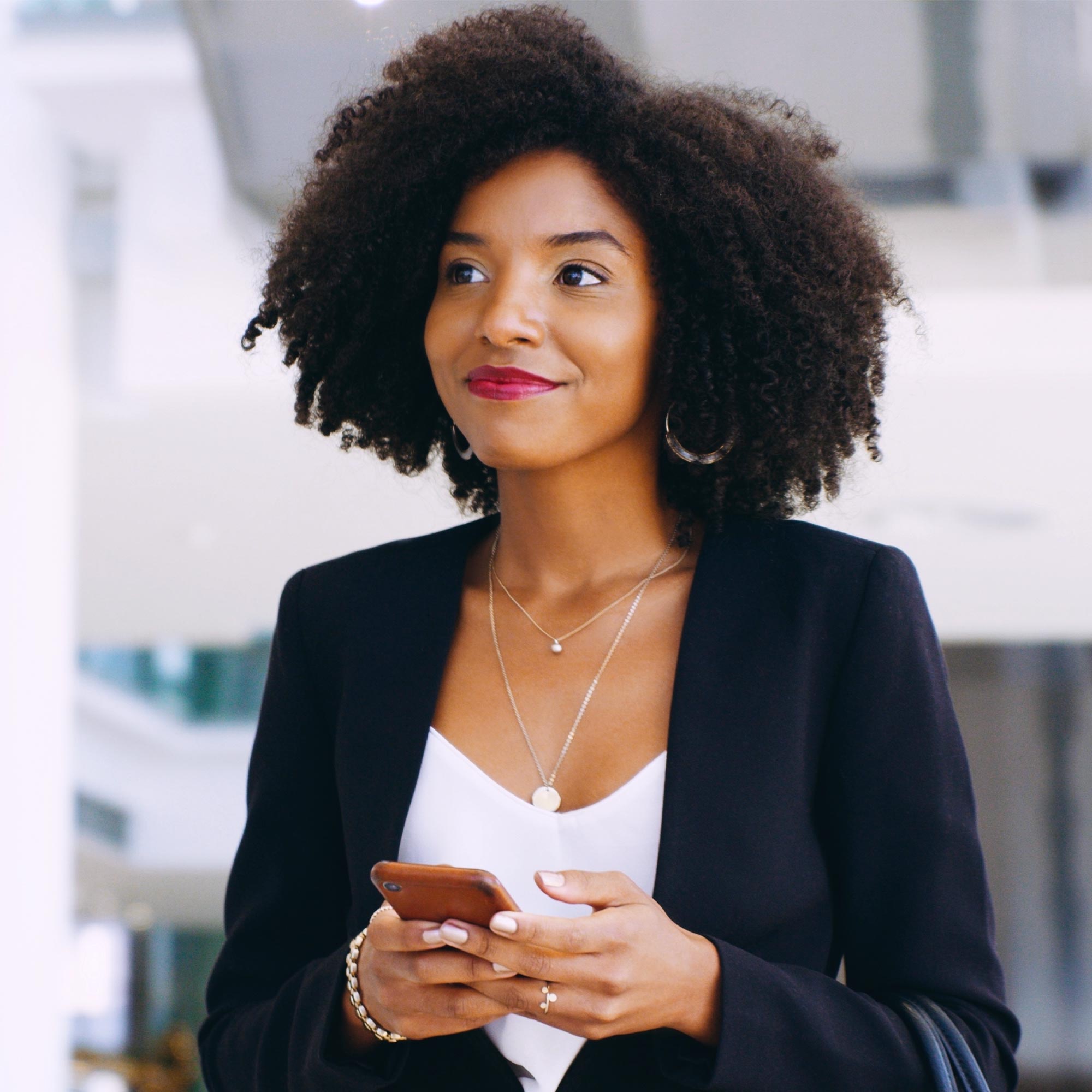 a woman holding a phone