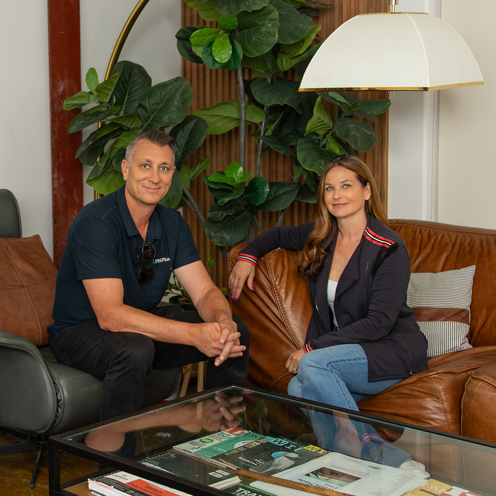 a man and woman sitting on a couch