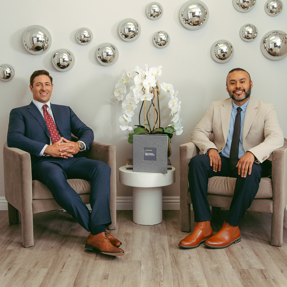 two men sitting in chairs
