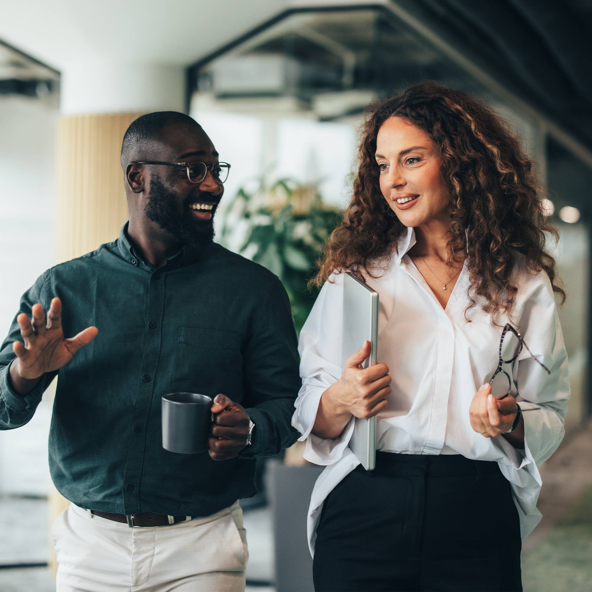 a man and woman talking in an office