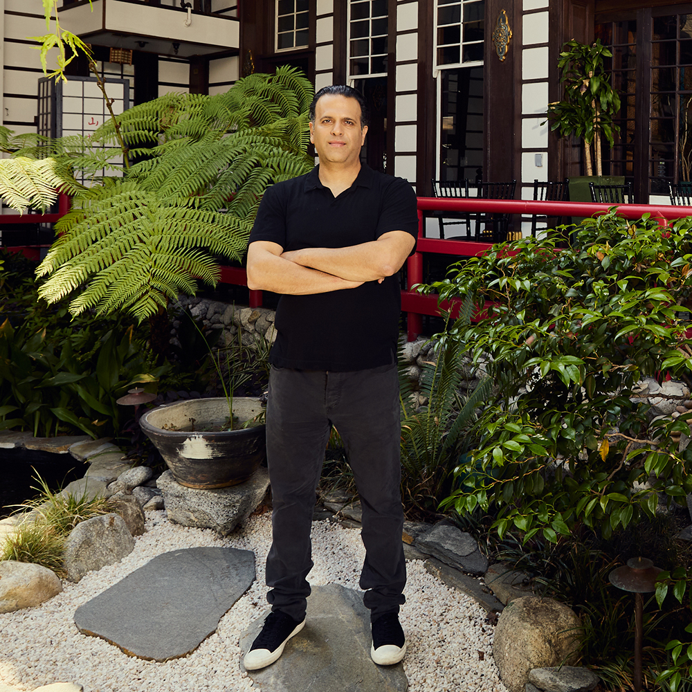 a man standing in front of a building