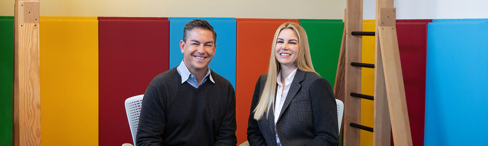 a man and woman smiling