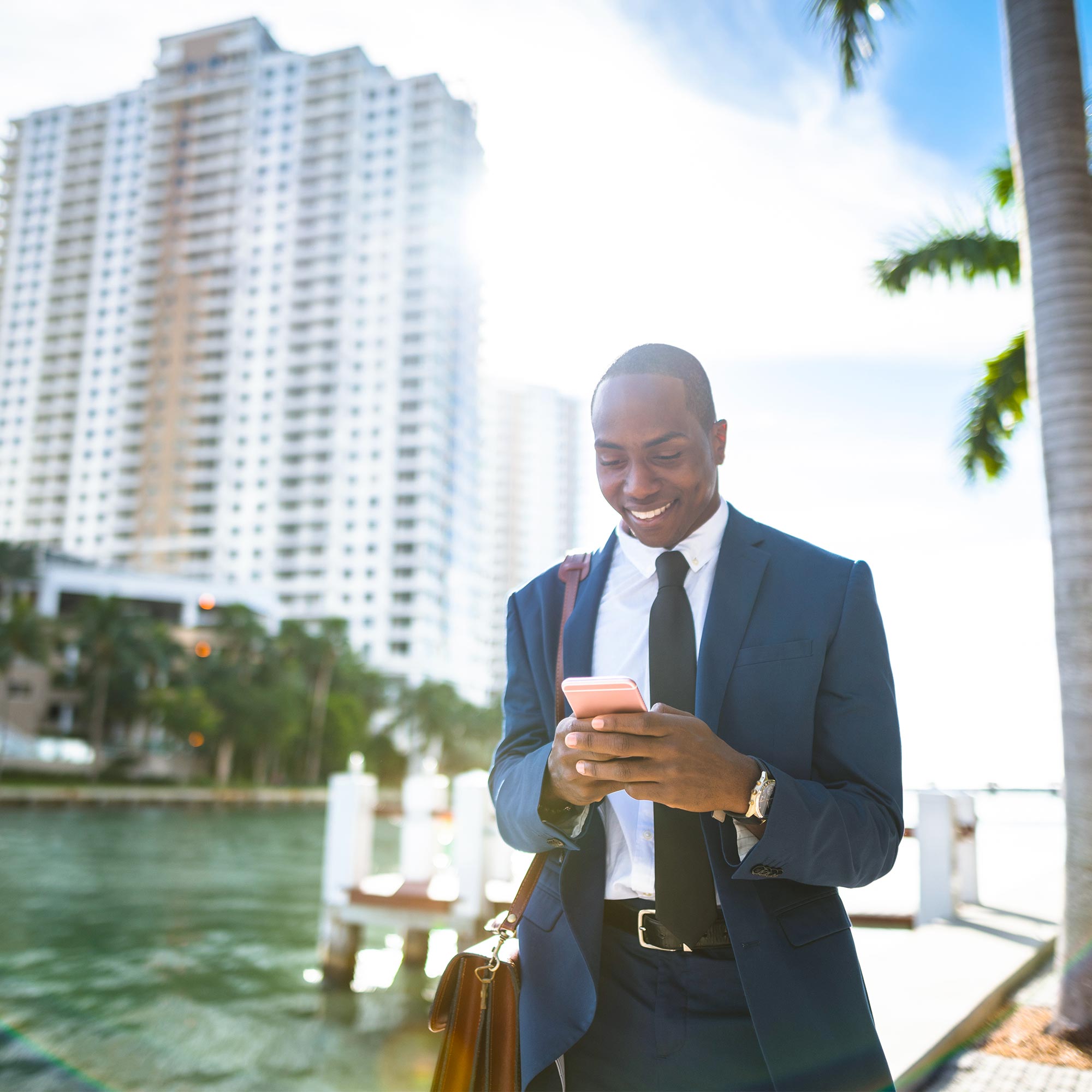 a man in a suit looking at a phone