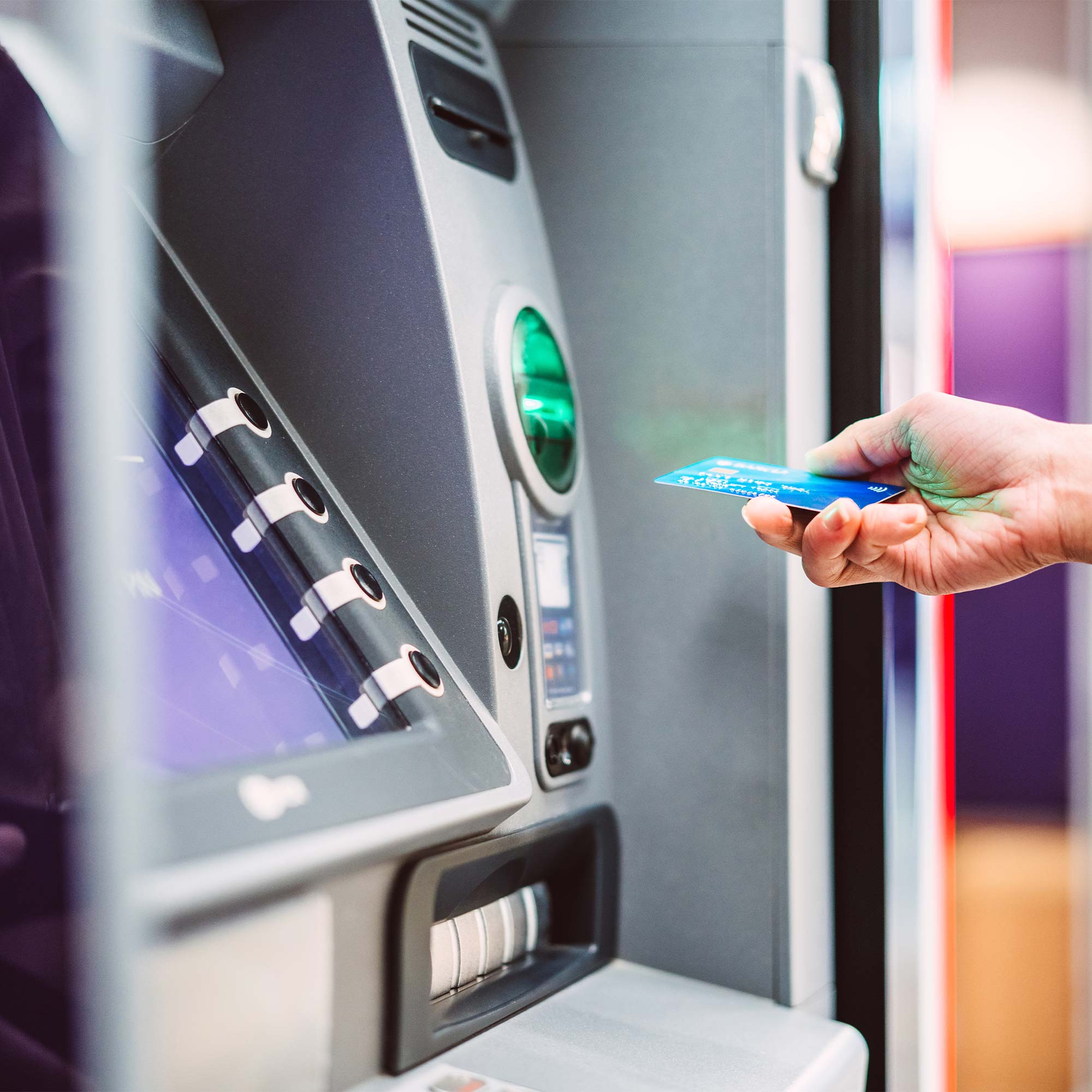 a hand holding a credit card