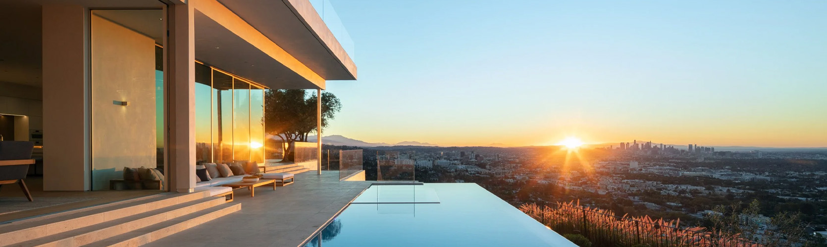 a pool on a rooftop overlooking a city