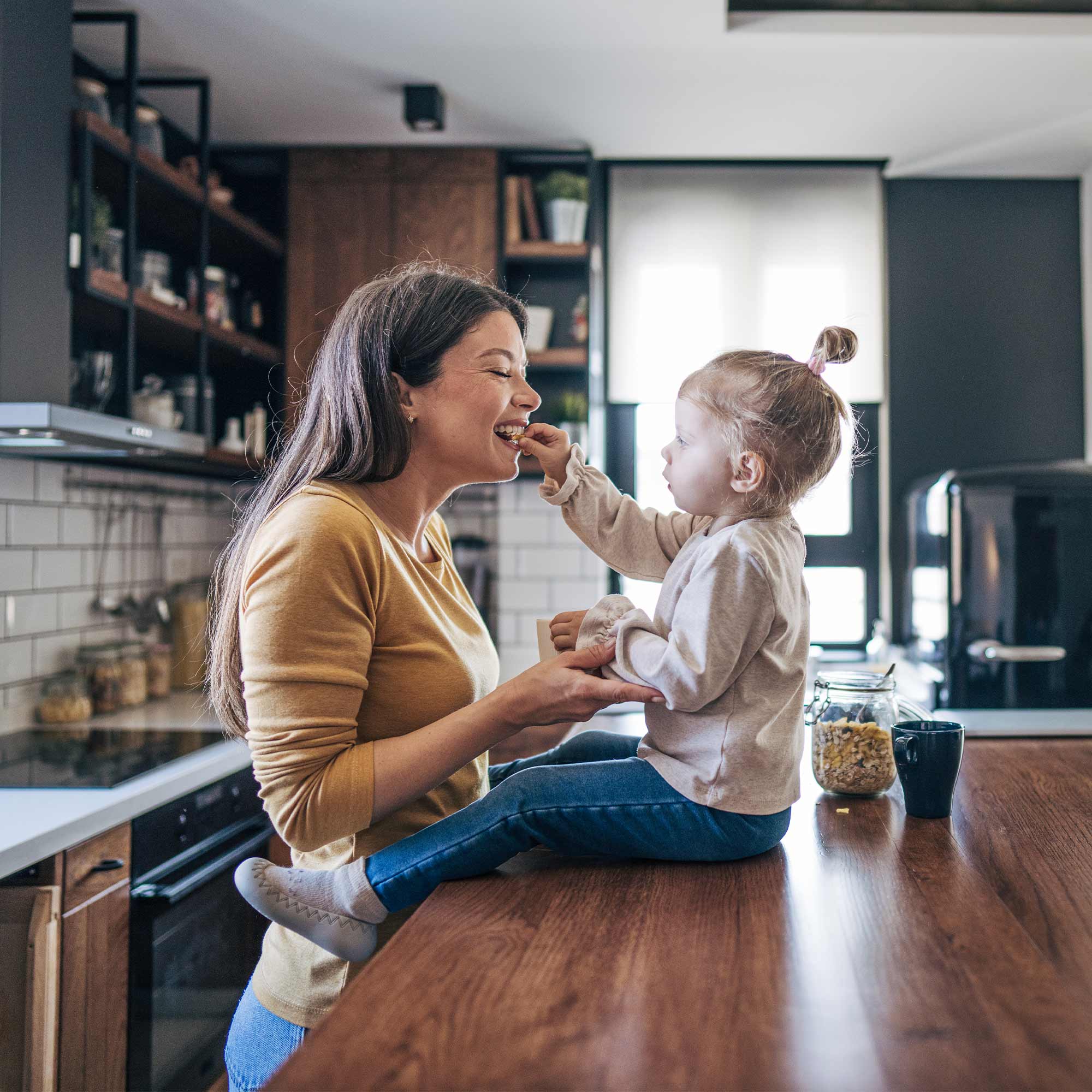 a woman feeding a child