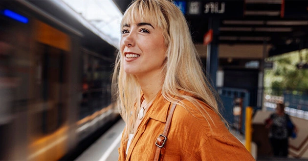 woman-standing-by-a-train woman-standing-by-a-train