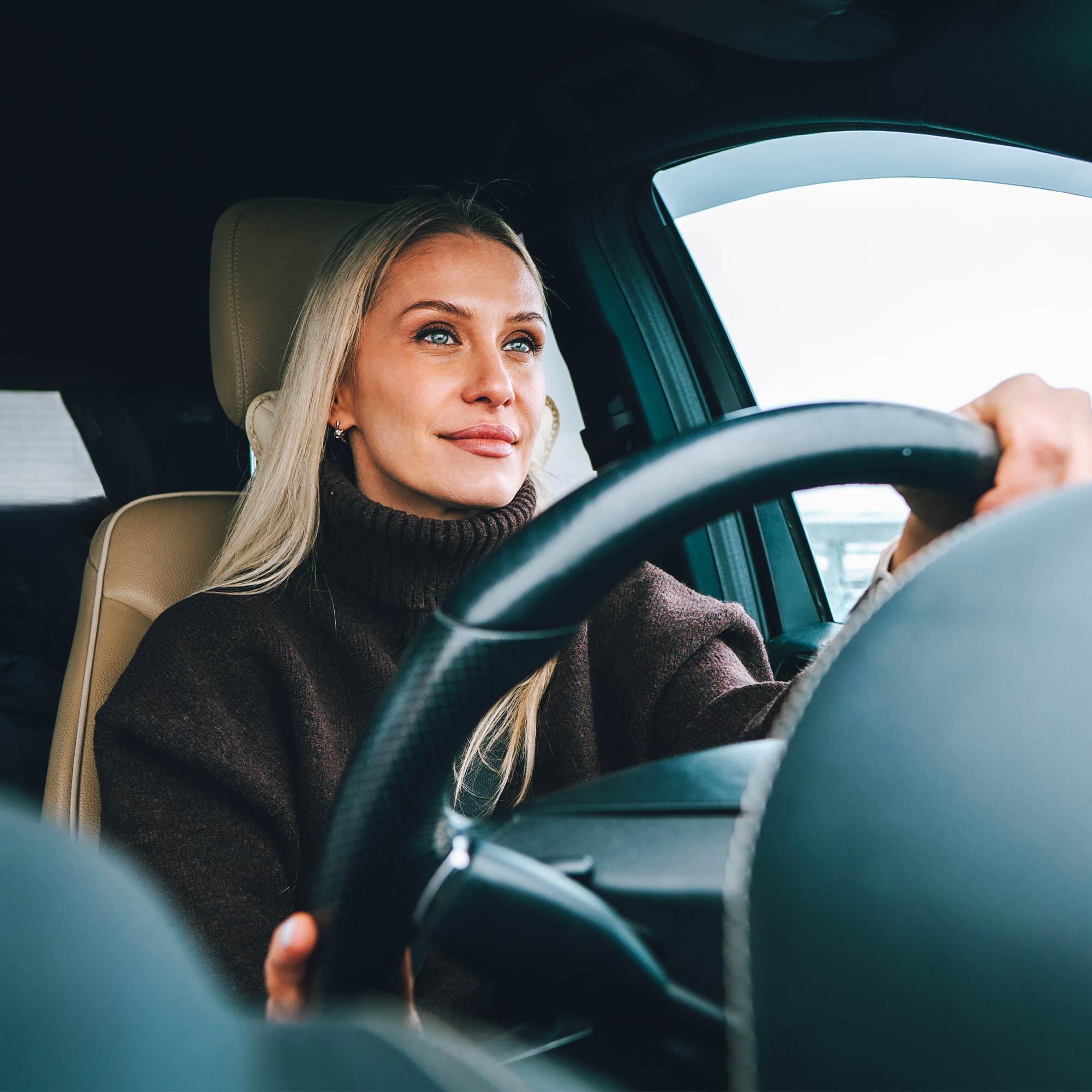 a woman driving a car