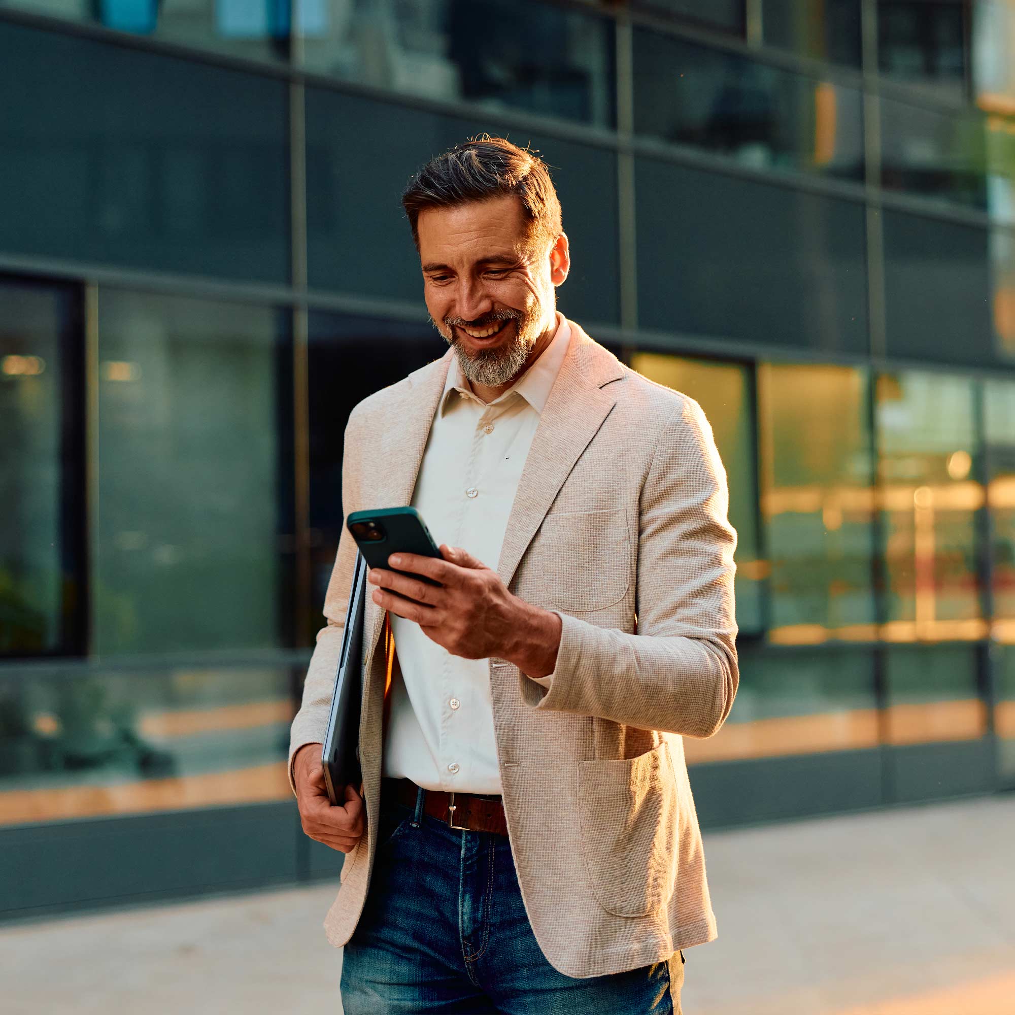 a man in a suit talking on a cell phone
