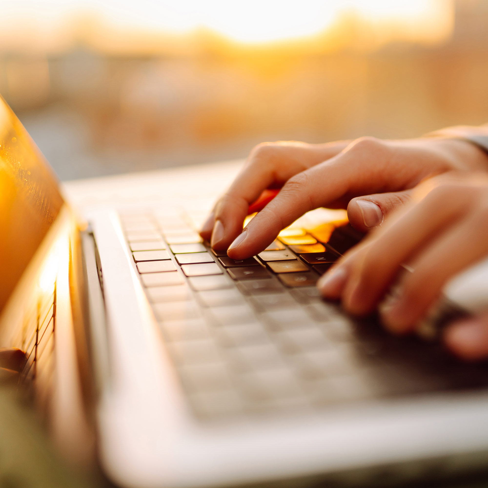 a person typing on a laptop