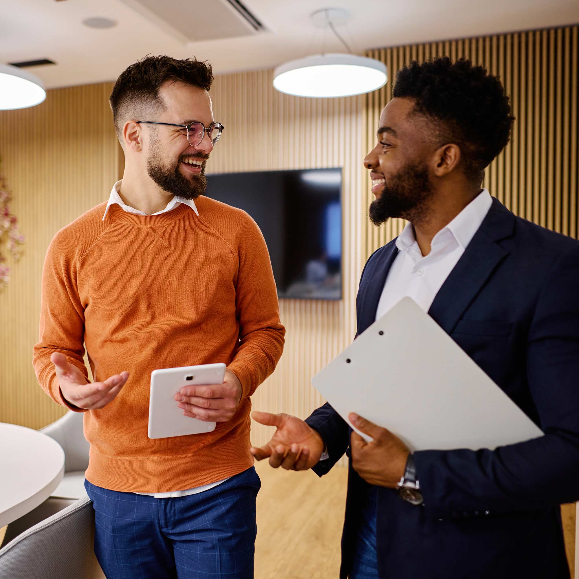 two men standing in a room