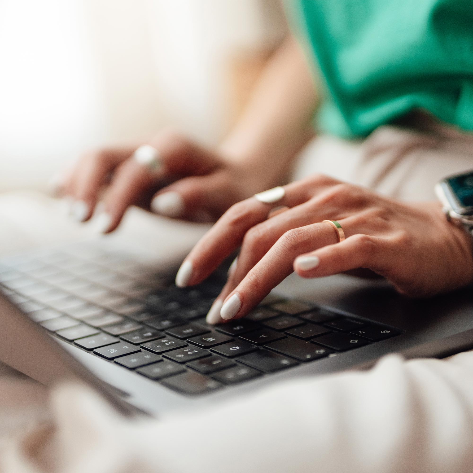 a person typing on a laptop