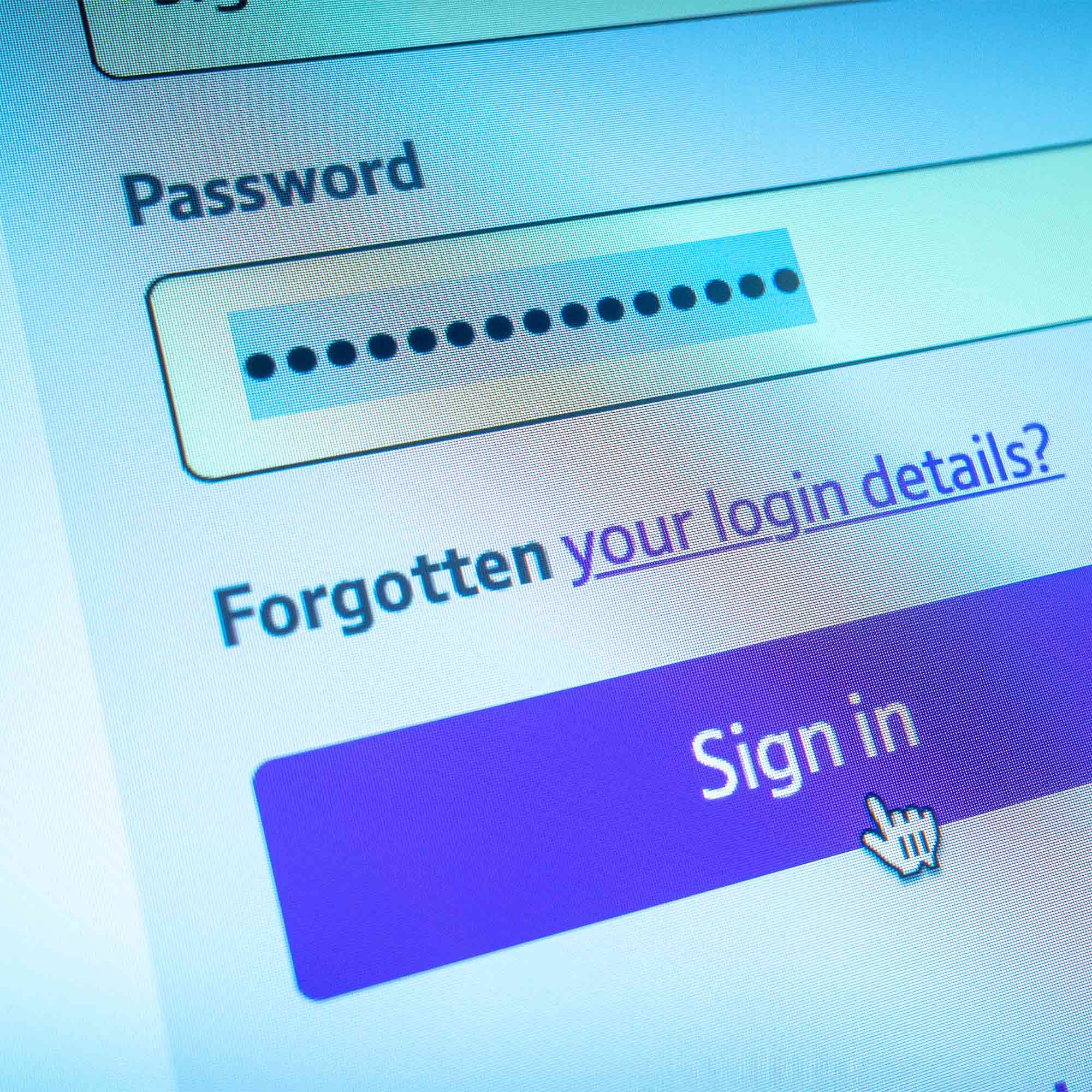 a computer screen with a login box and a finger pointing at the screen