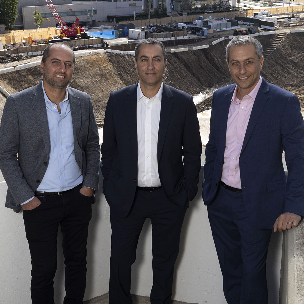 a group of men standing on a ledge