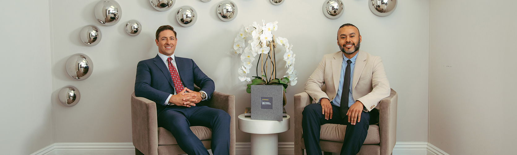 two men sitting in chairs