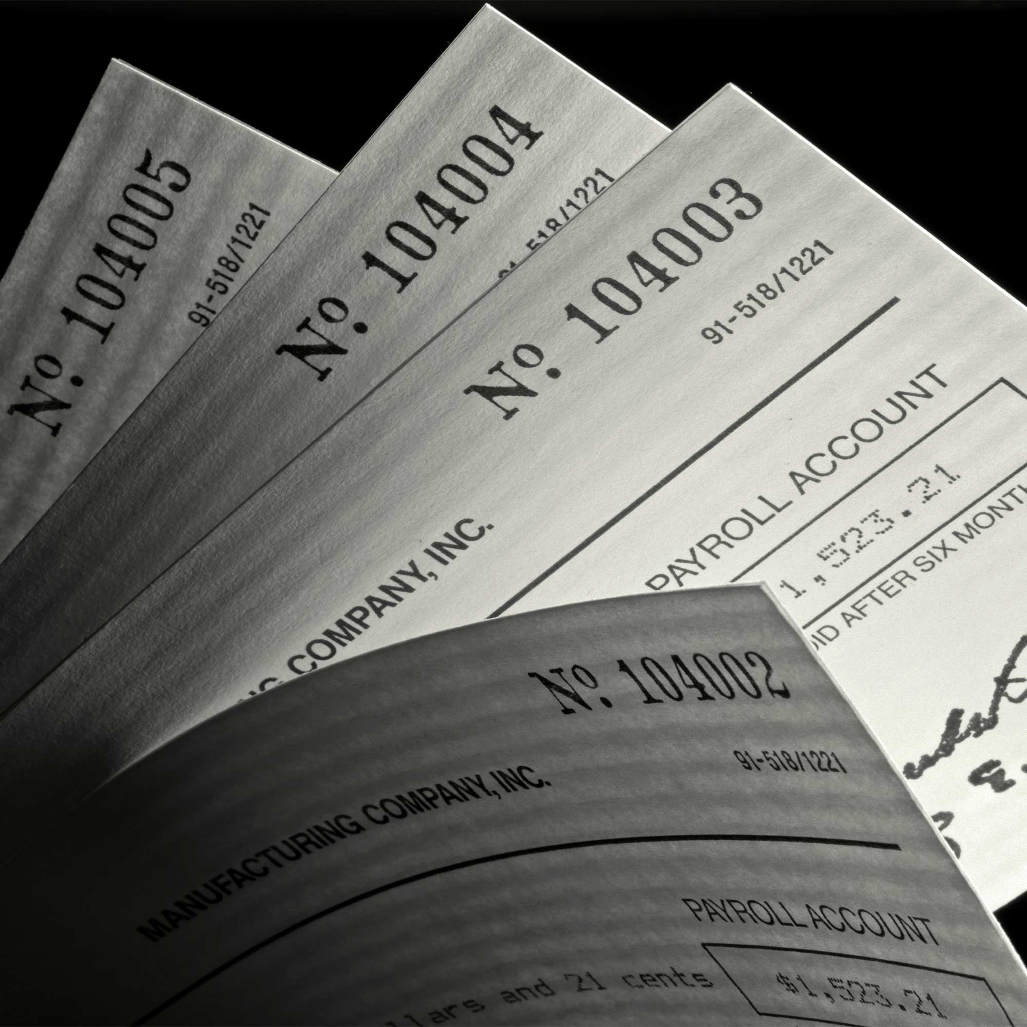 several tax forms with numbers and a check