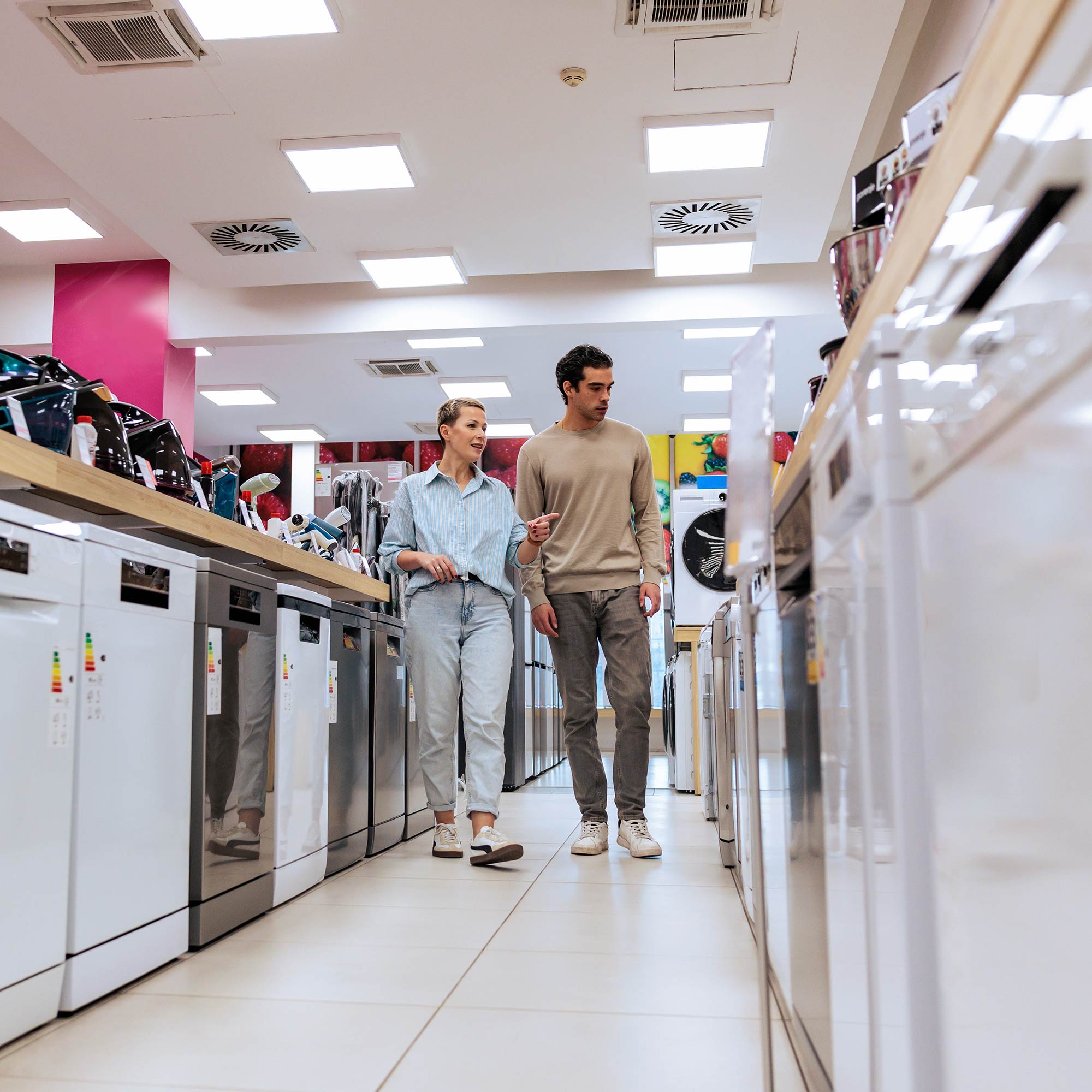 a couple of men standing in a store