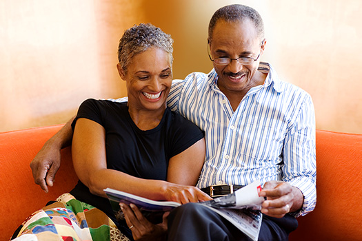 Couple Smiling and Reading